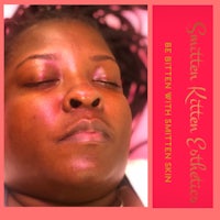 a woman is laying down with her eyes closed